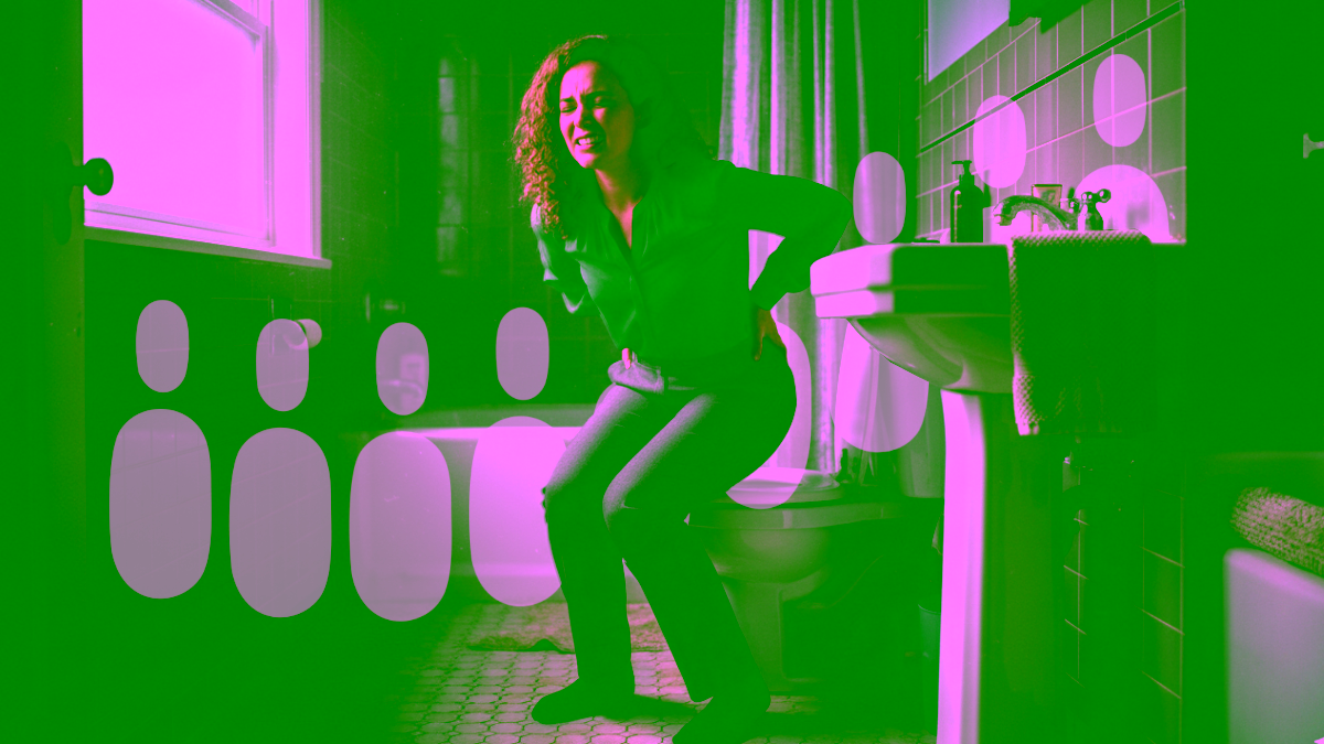 Woman in pain getting on or off the the toilet